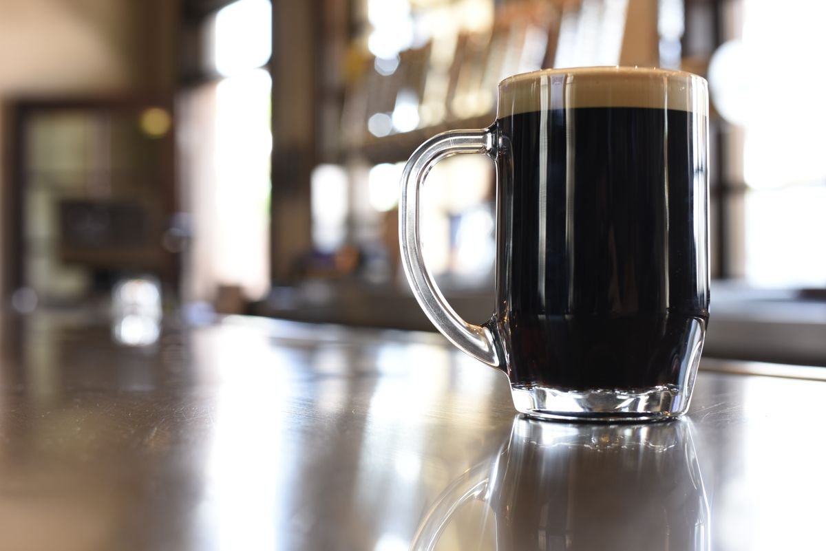 A dark stout on a quiet pub bar counter