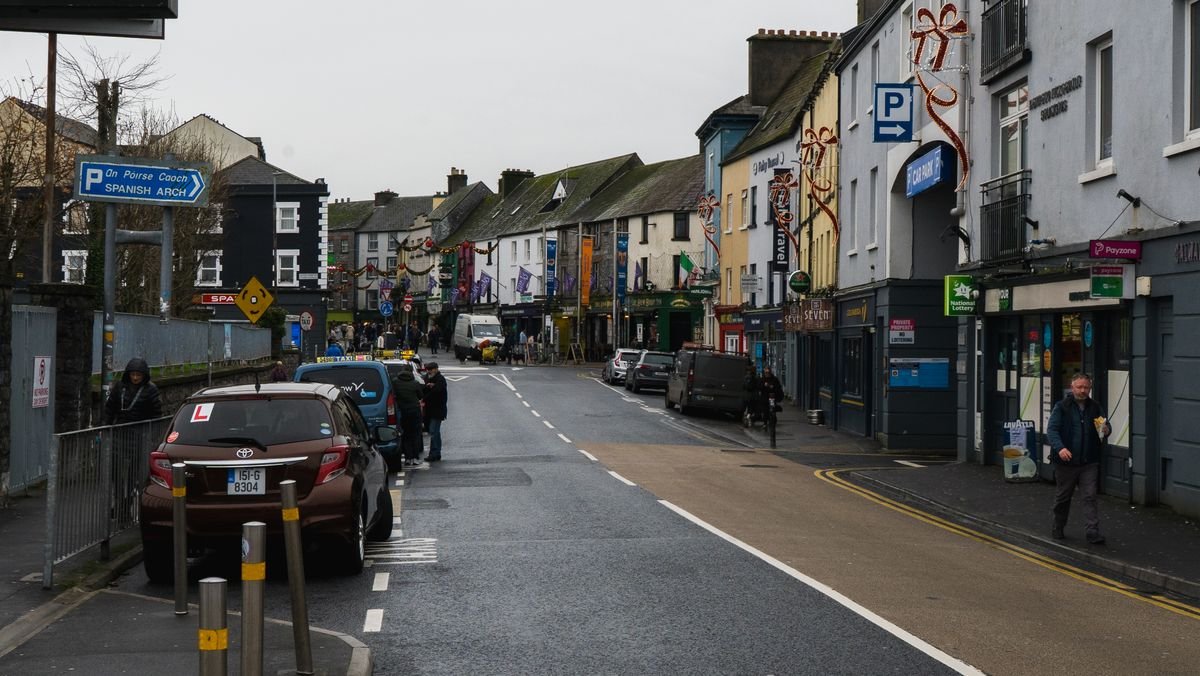 Quiet Irish town street on a grey winter day with festive decorations