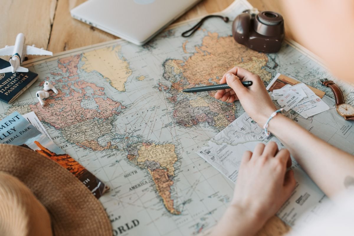 Planning a trip over a map, checking the details before booking a tour