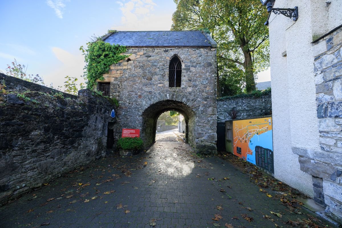 An old stone gatehouse archway at an Irish heritage site