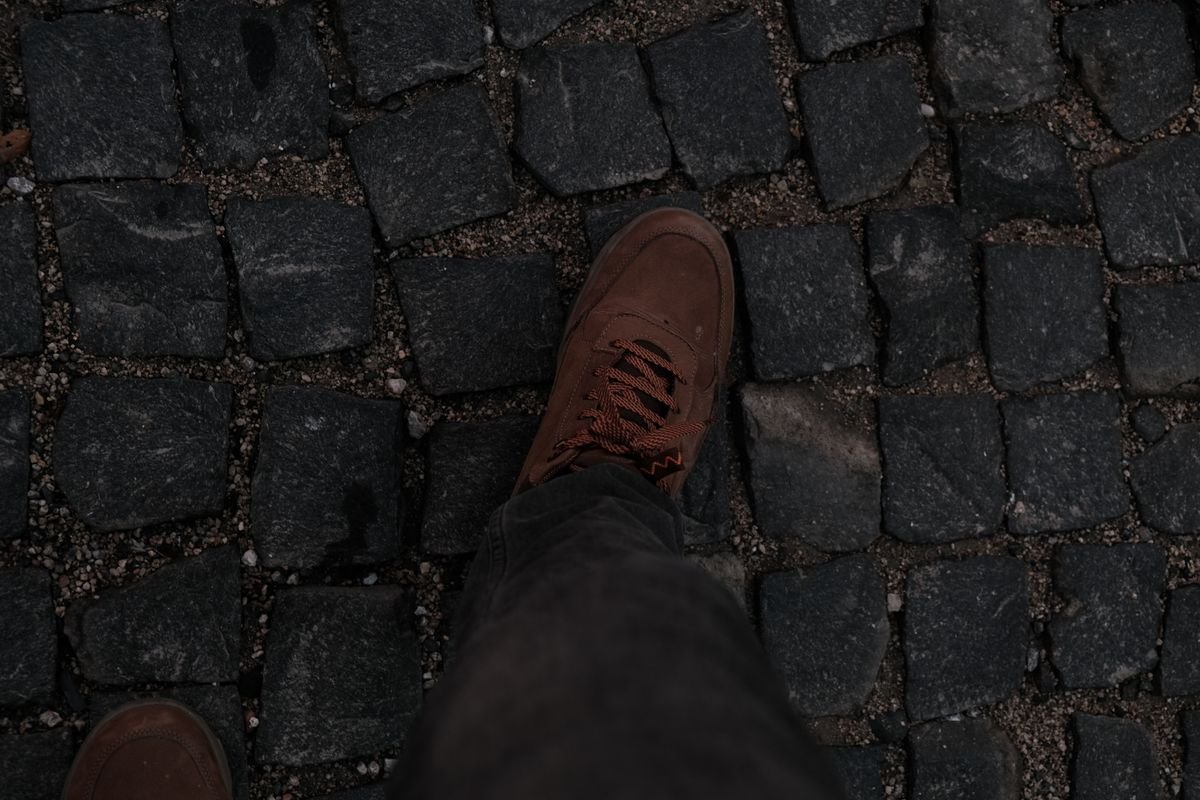 Sturdy walking shoes on cobblestones, handy for the uneven ground at the Rock