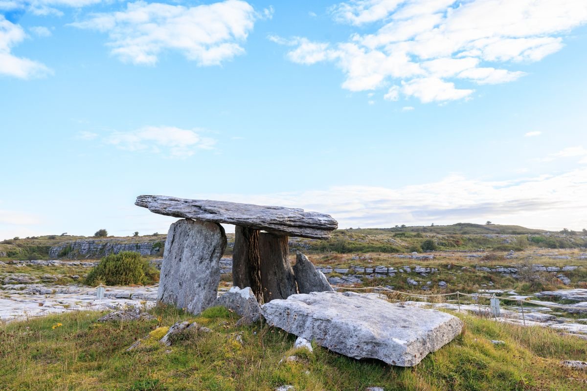 Poulnabrone dolmen standing on the rocky Burren under a blue sky