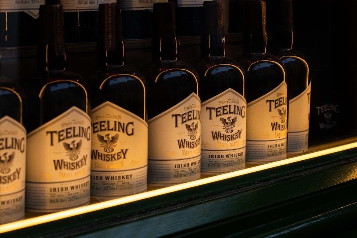 Bottles of Teeling Irish whiskey lit on a shelf