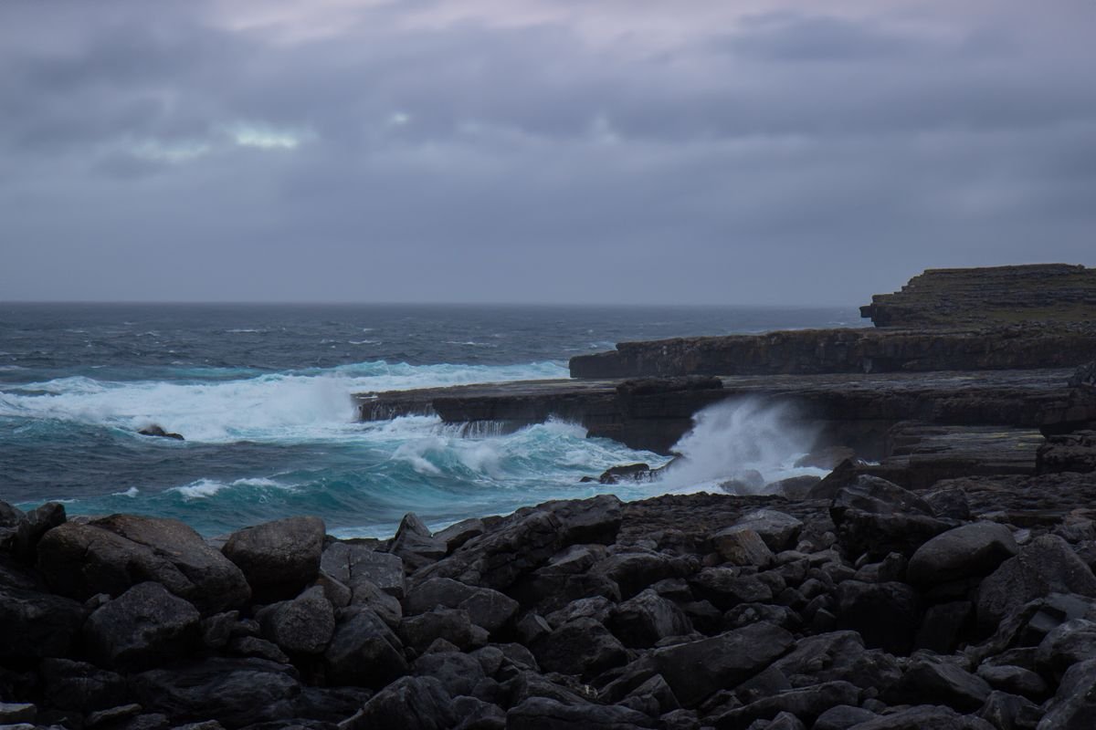 Rough Atlantic waves breaking on a rocky Irish coast on a windy day