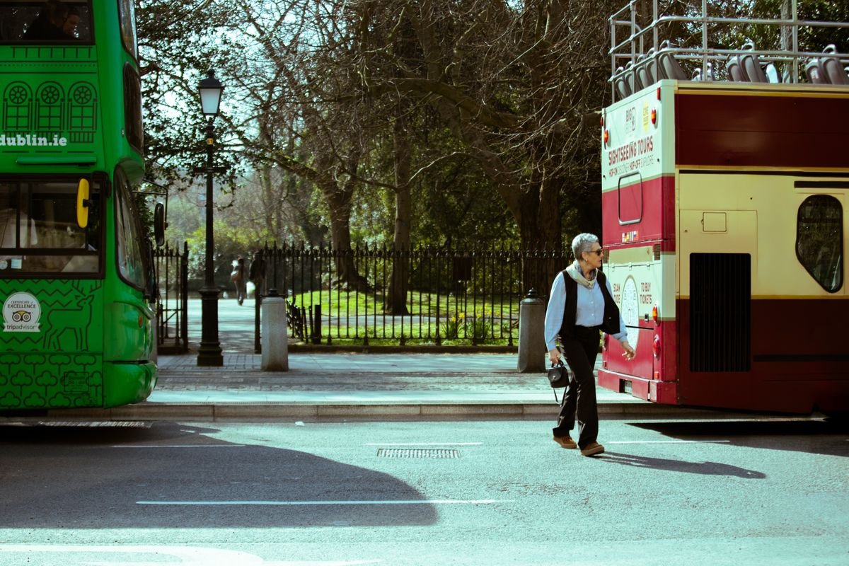 An open-top sightseeing tour bus on a street in Ireland