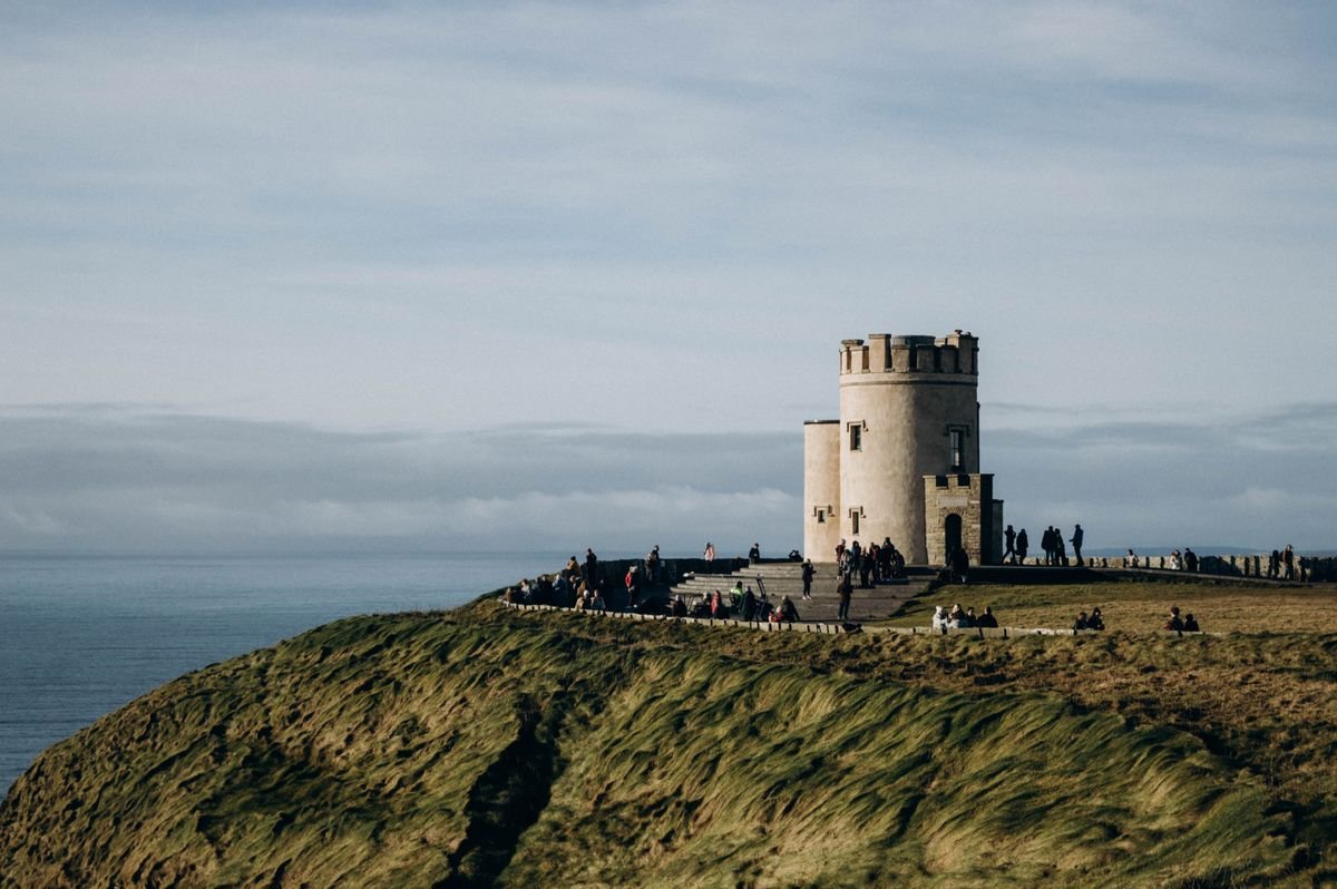 O'Brien's Tower on the clifftop at the Cliffs of Moher with visitors on the path