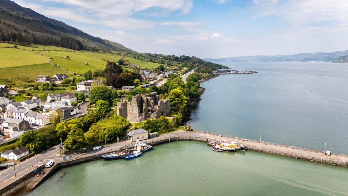 Carlingford with King John's Castle above the harbour and the Mourne Mountains behind