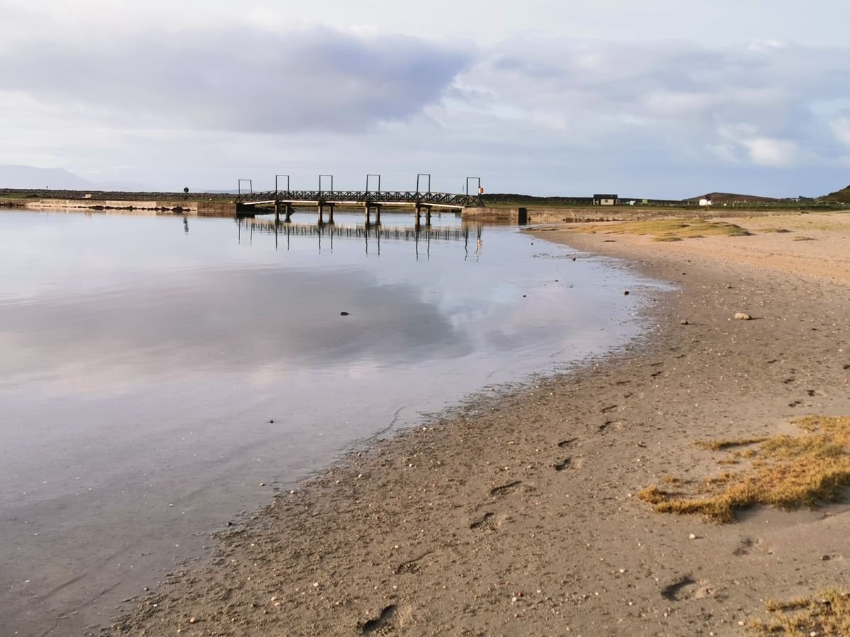 Mulranny beach causeway footbridge on Clew Bay in County Mayo with calm water