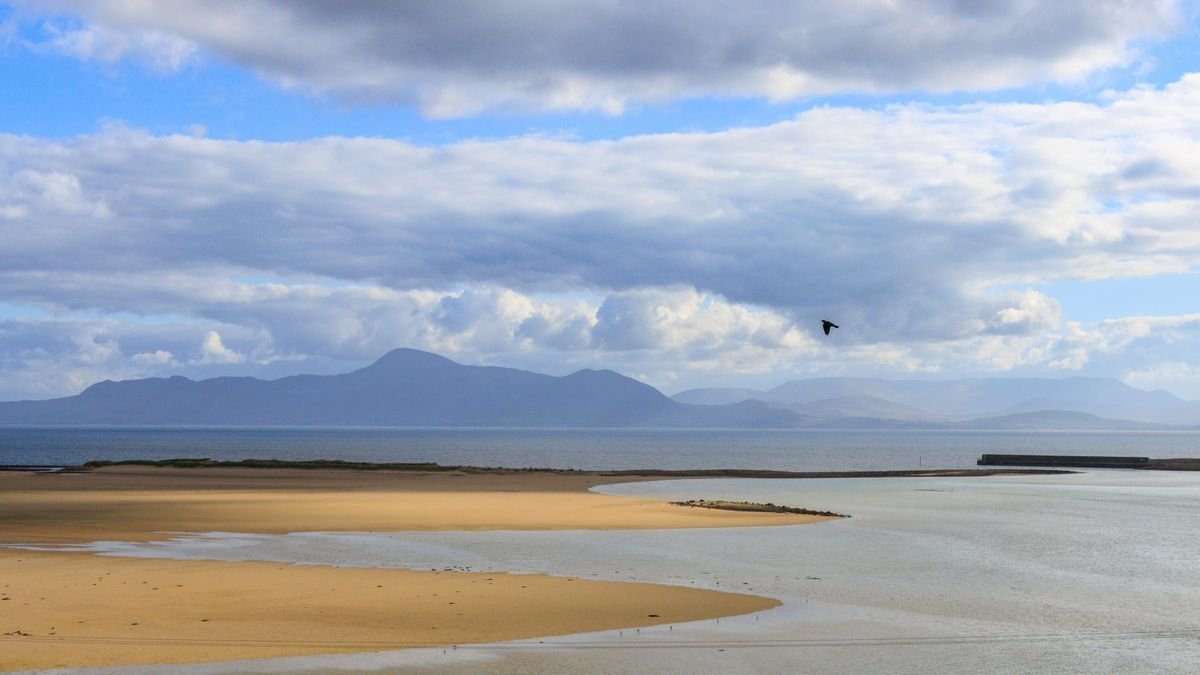 Elly Bay on the Mullet Peninsula in Mayo, a sheltered curve of golden sand with flat water