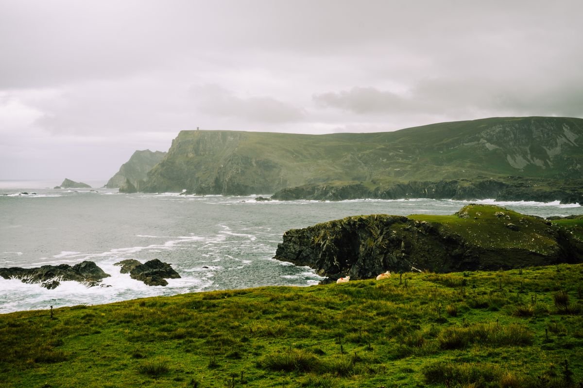 Green fields and rocky coast in southwest Donegal near Glencolmcille