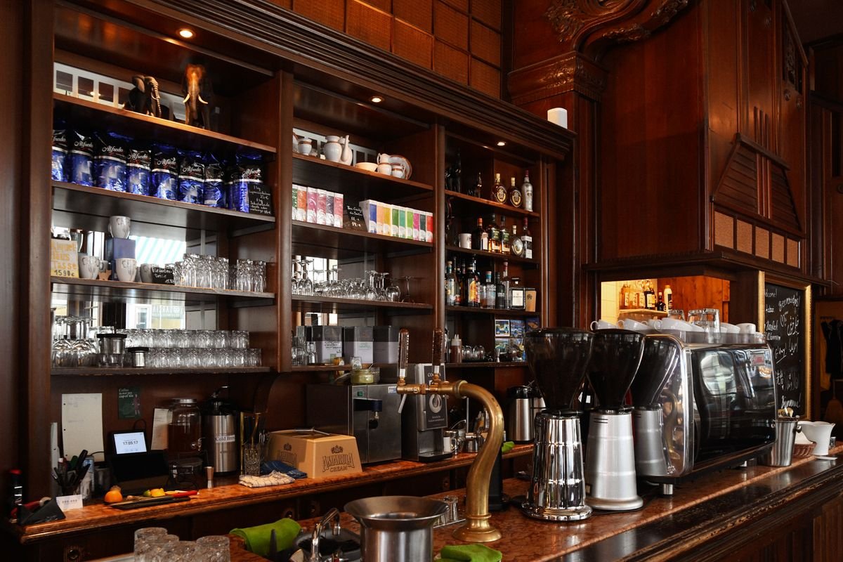 A cafe counter and shelves inside a visitor centre