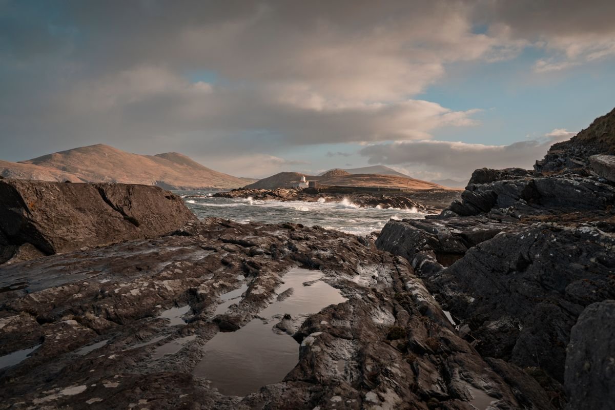 The wild Atlantic coast with mountains and crashing waves in Kerry