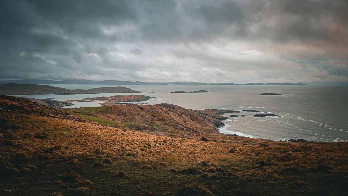 Ring of Kerry coastline with headlands under a grey sky