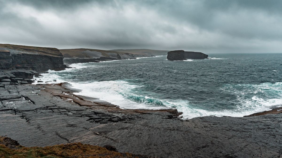 Moody winter coastline with stormy grey sea