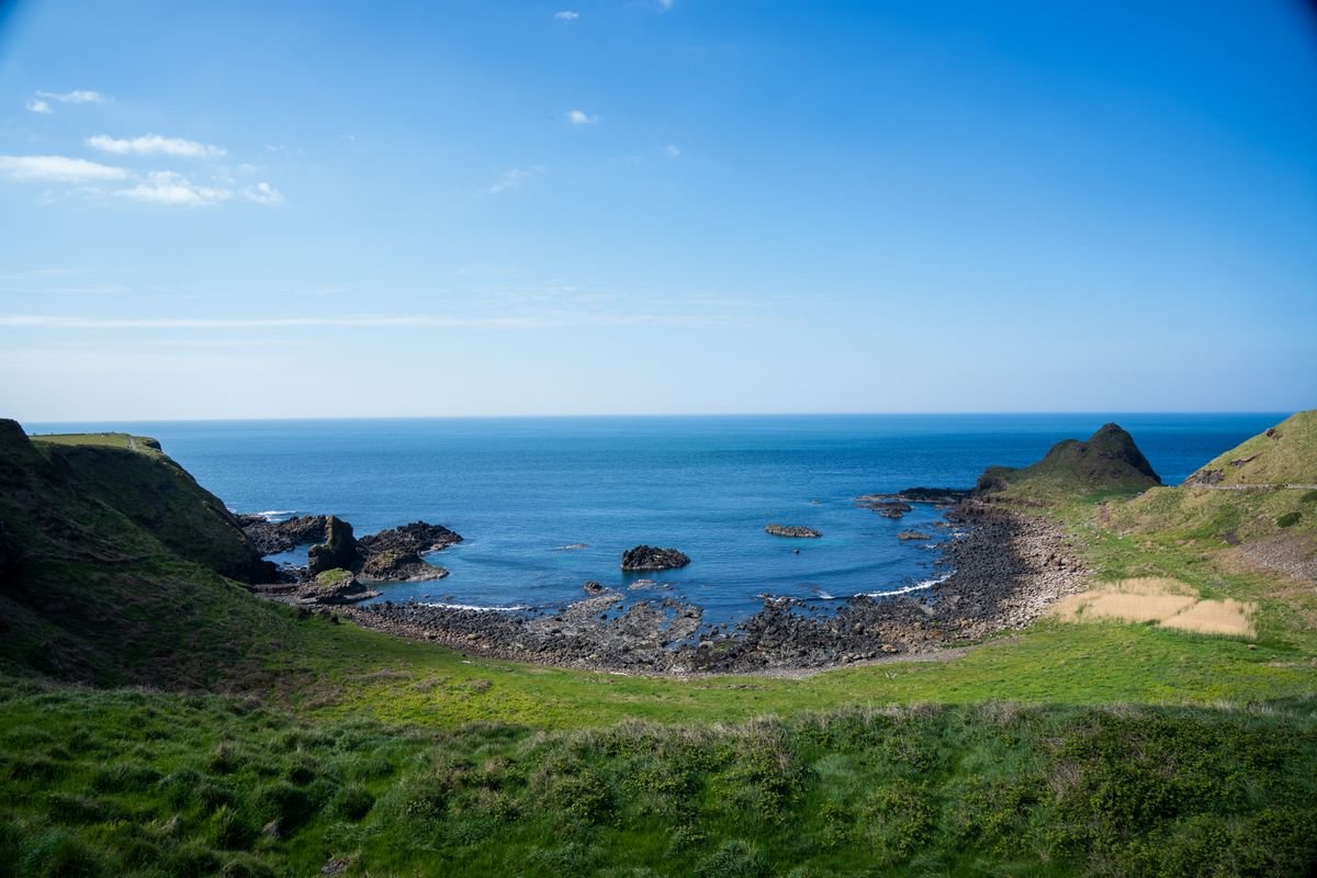 Green cove and blue sea on the Causeway Coast