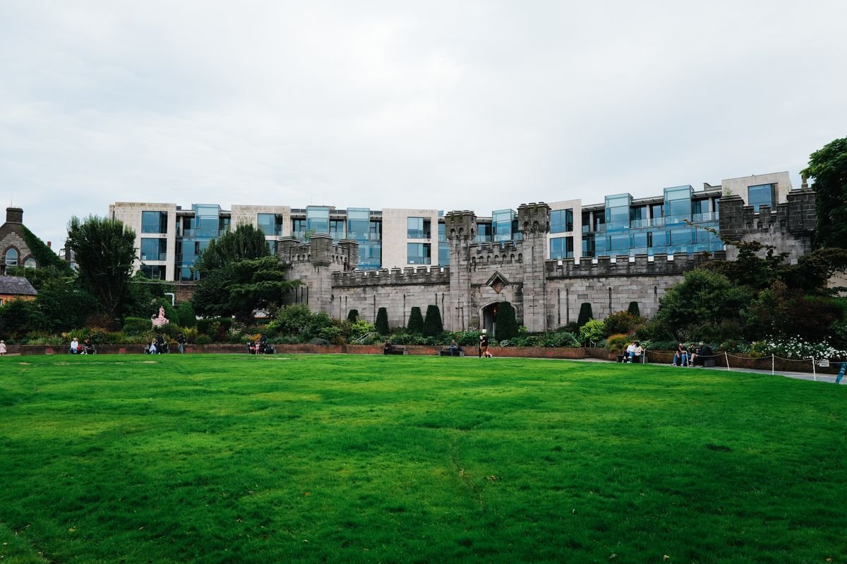 Rear wall of Dublin Castle above green lawn