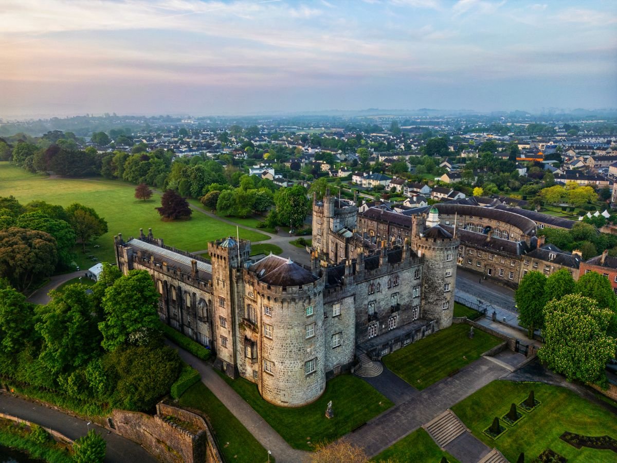 Kilkenny Castle above the river, a 30-minute walk from town along the Canal Walk