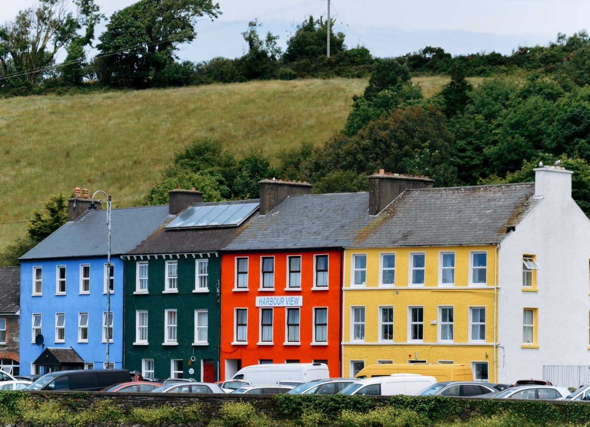 Row of colourful townhouses on a hillside in a west of Ireland town