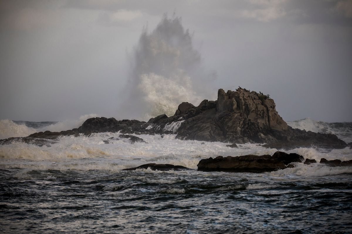 Storm wave breaking over rocks on the Donegal coast in winter