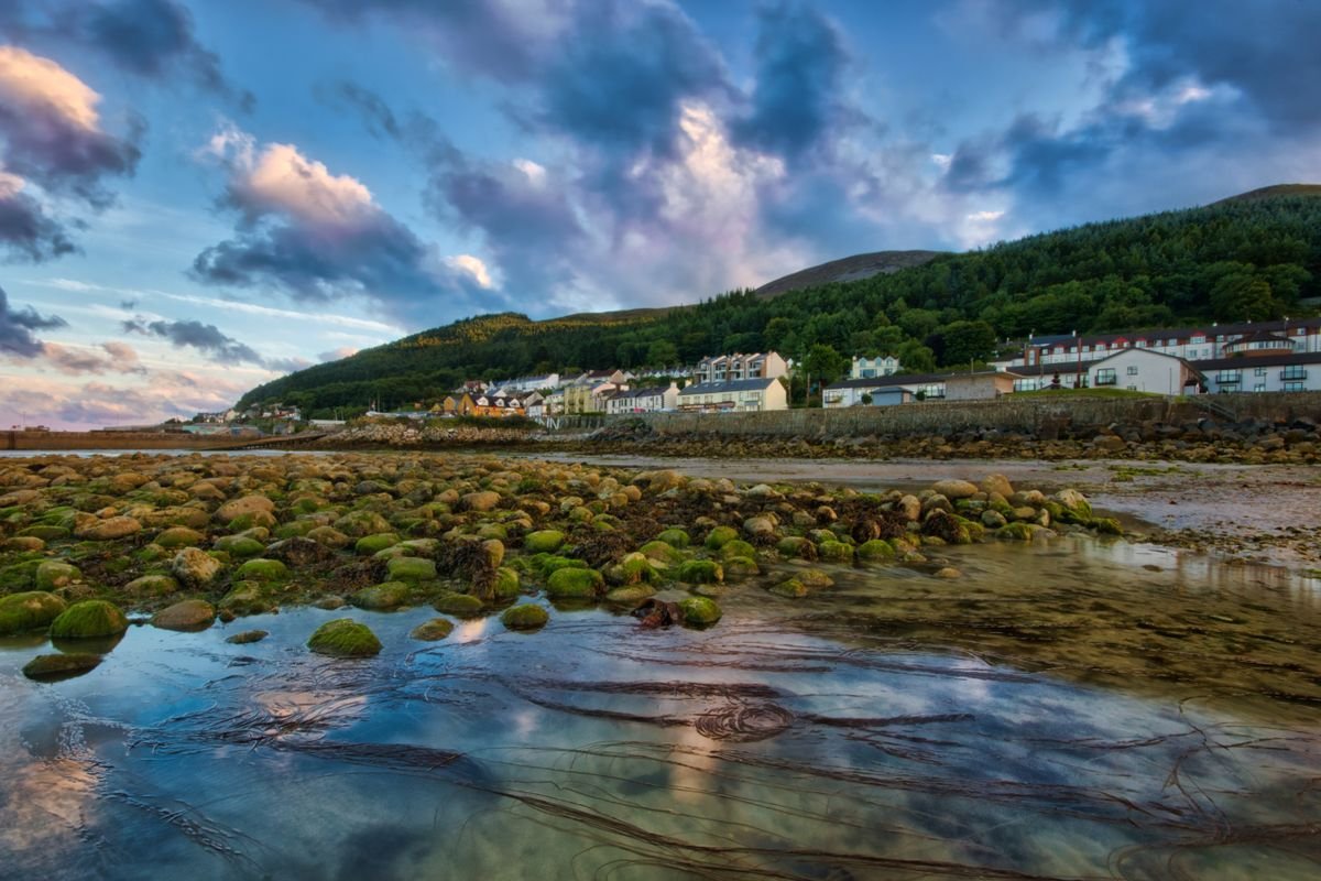 The Mourne Mountains rising behind the seaside town of Newcastle in Northern Ireland