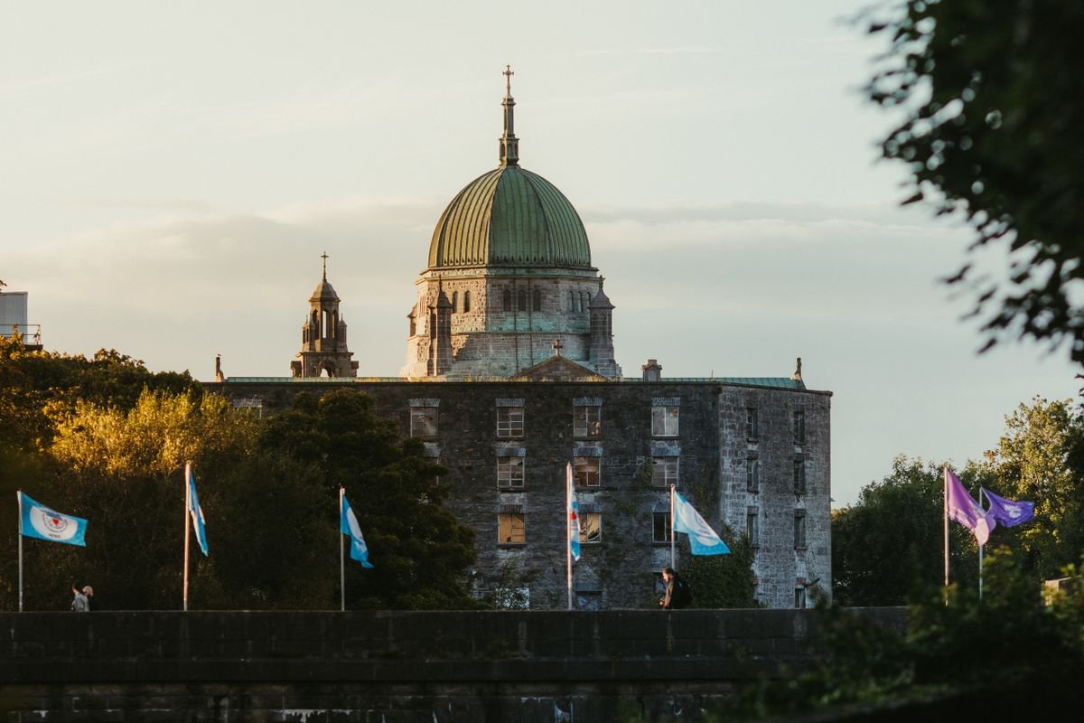 Galway Cathedral with its green copper dome lit by evening light