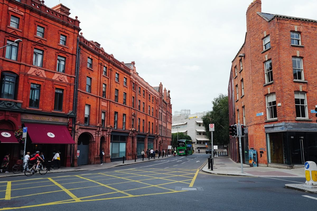 A Dublin red-brick street with a corner pub, the kind of neighborhood north and south of the river worth basing yourself in.