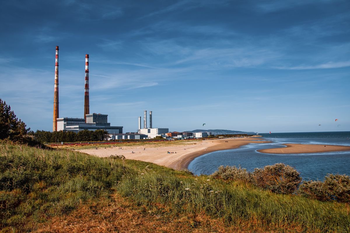 Sandymount Strand beach in Dublin with the Poolbeg chimneys in the distance
