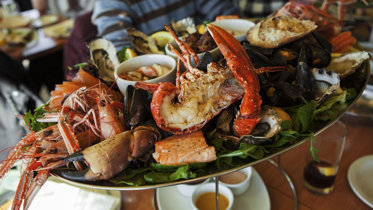 A seafood platter of crab, langoustines and shellfish on ice