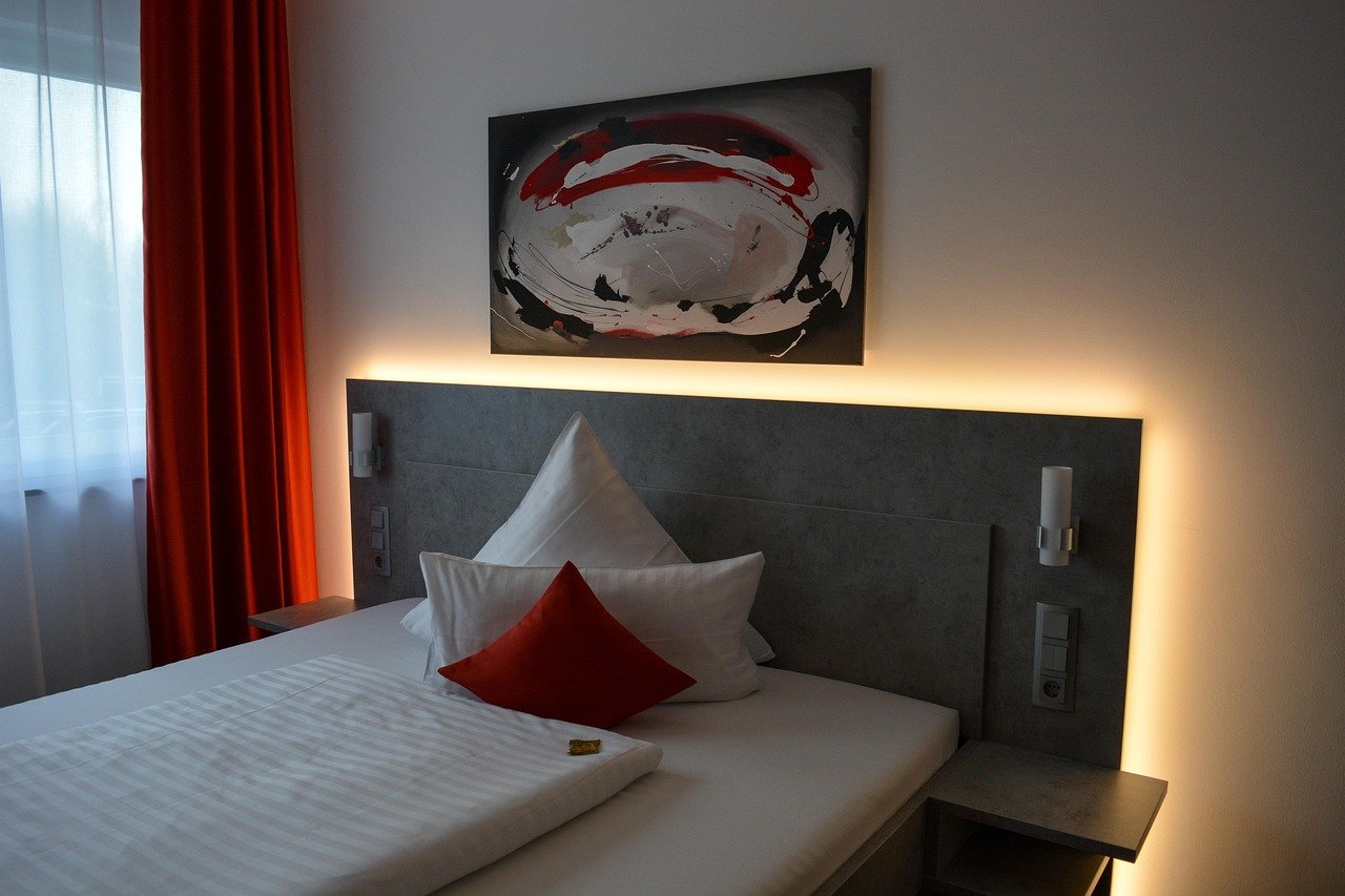 A modern hotel room with a made bed near Dublin Airport