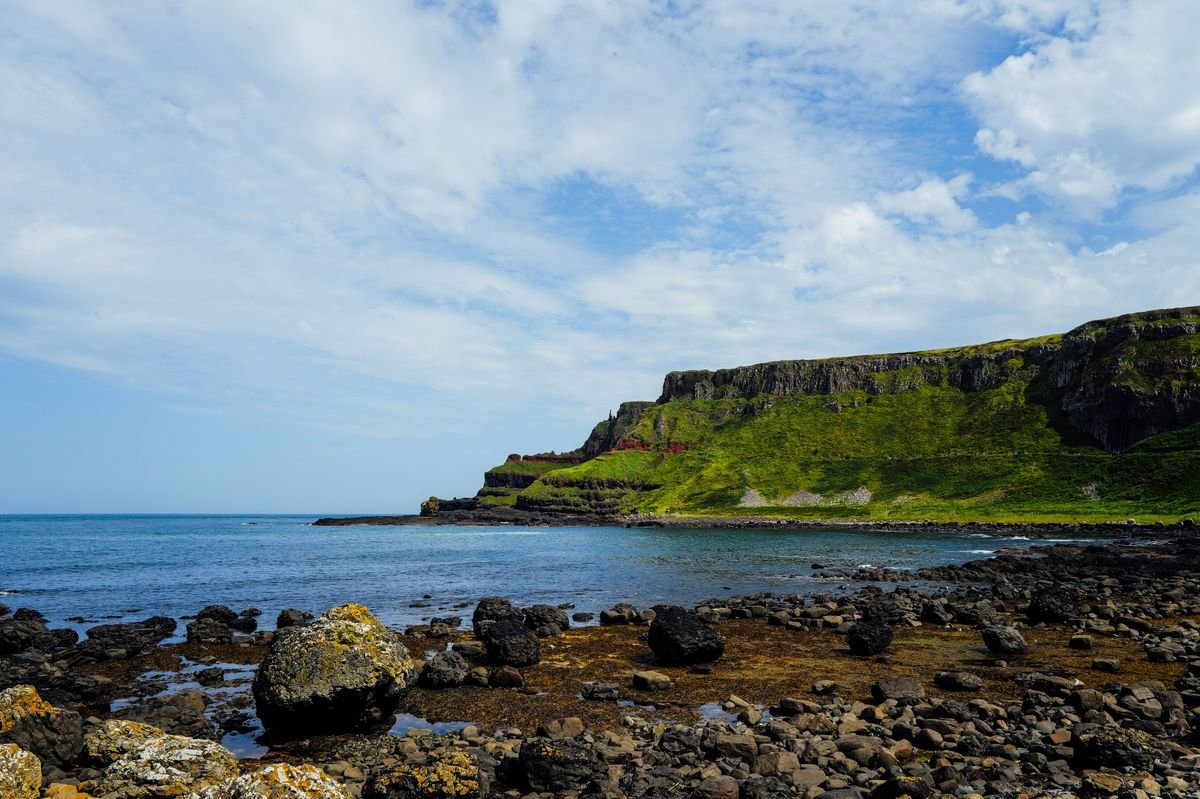 Things to do in Northern Ireland: the Causeway Coast headland dropping into the Atlantic
