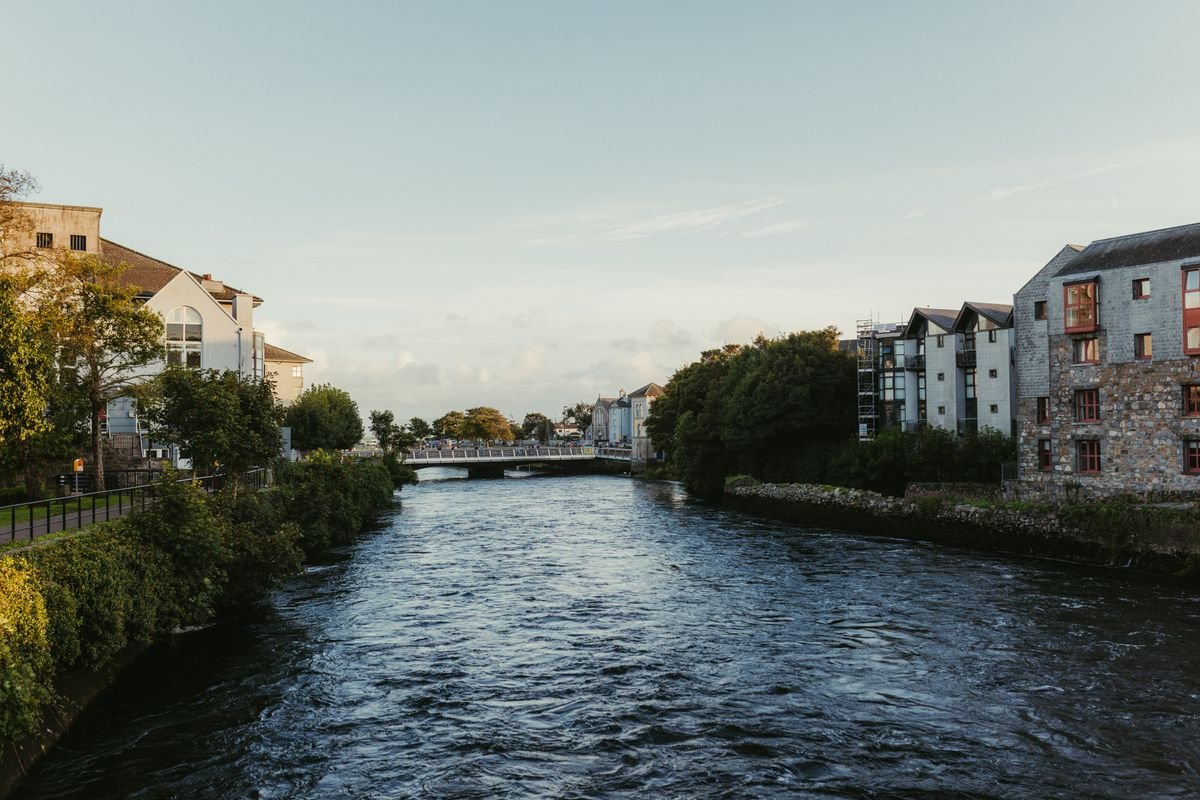 The River Corrib running through Galway city between the buildings