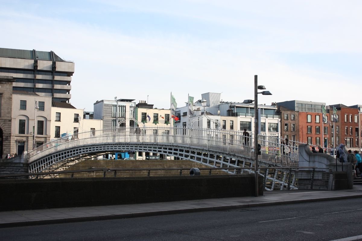 The white Ha'penny Bridge over the River Liffey in Dublin