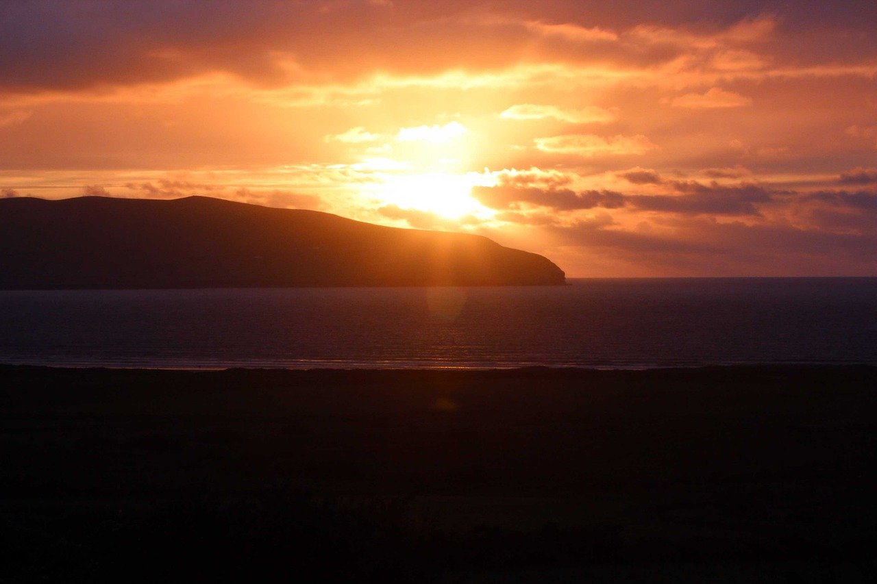 Sunset over a headland on the Dingle Peninsula coast
