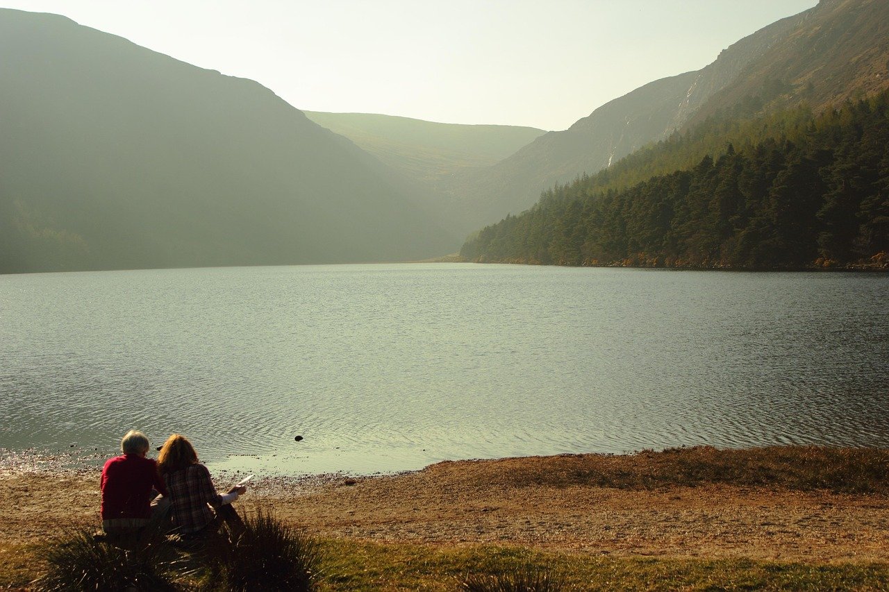 A dark mountain lake in a hollow below a ridge in the Wicklow Mountains