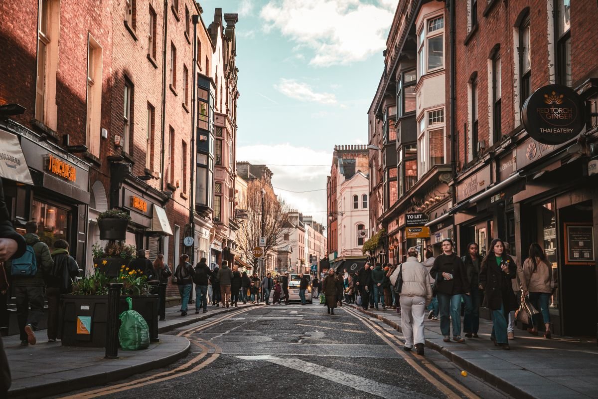 Busy Dublin street lined with shops and pubs