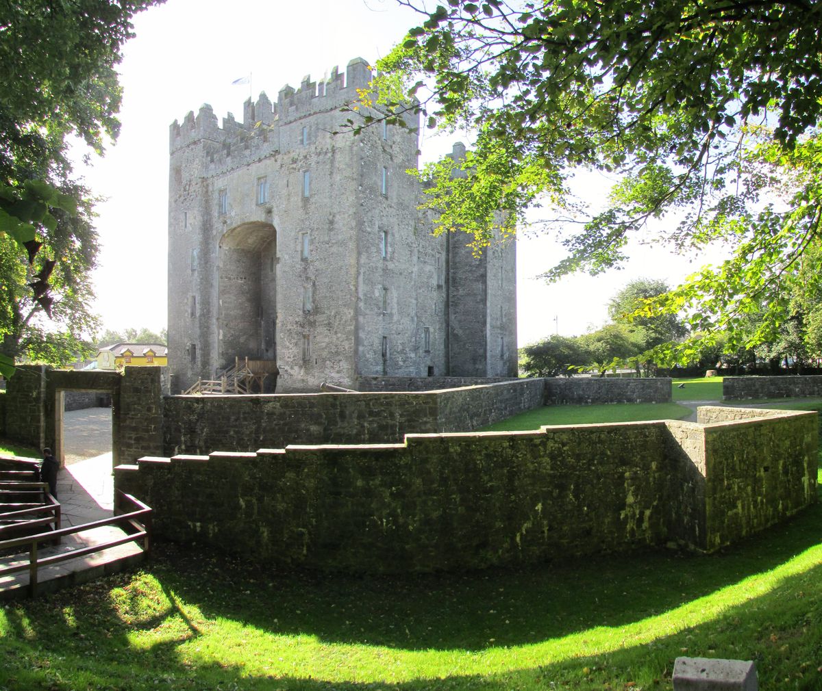Bunratty Castle and folk park walls with green lawn
