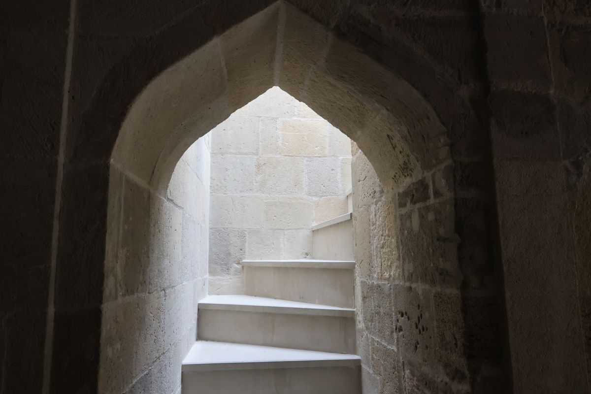 Stone spiral staircase inside a medieval castle keep