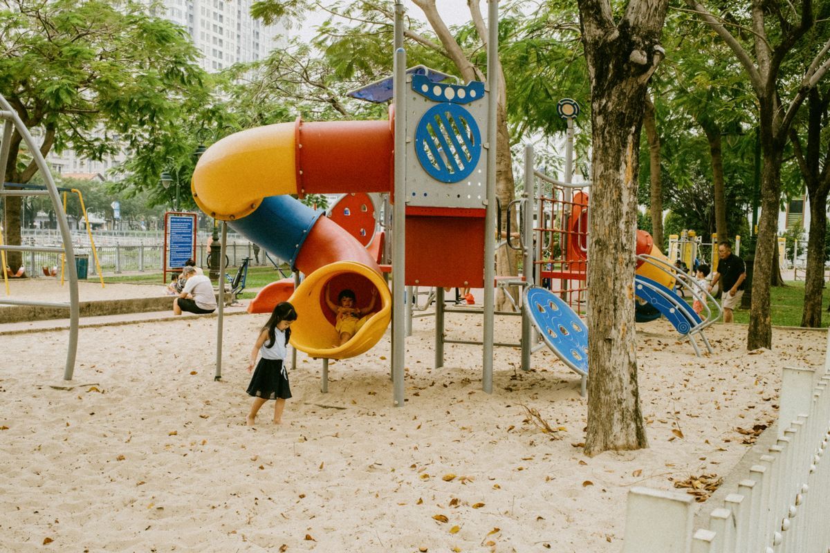 Children playing on a colourful outdoor playground