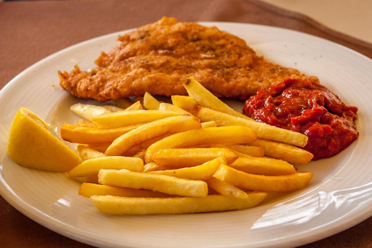 Breaded cutlet and chips on a plate