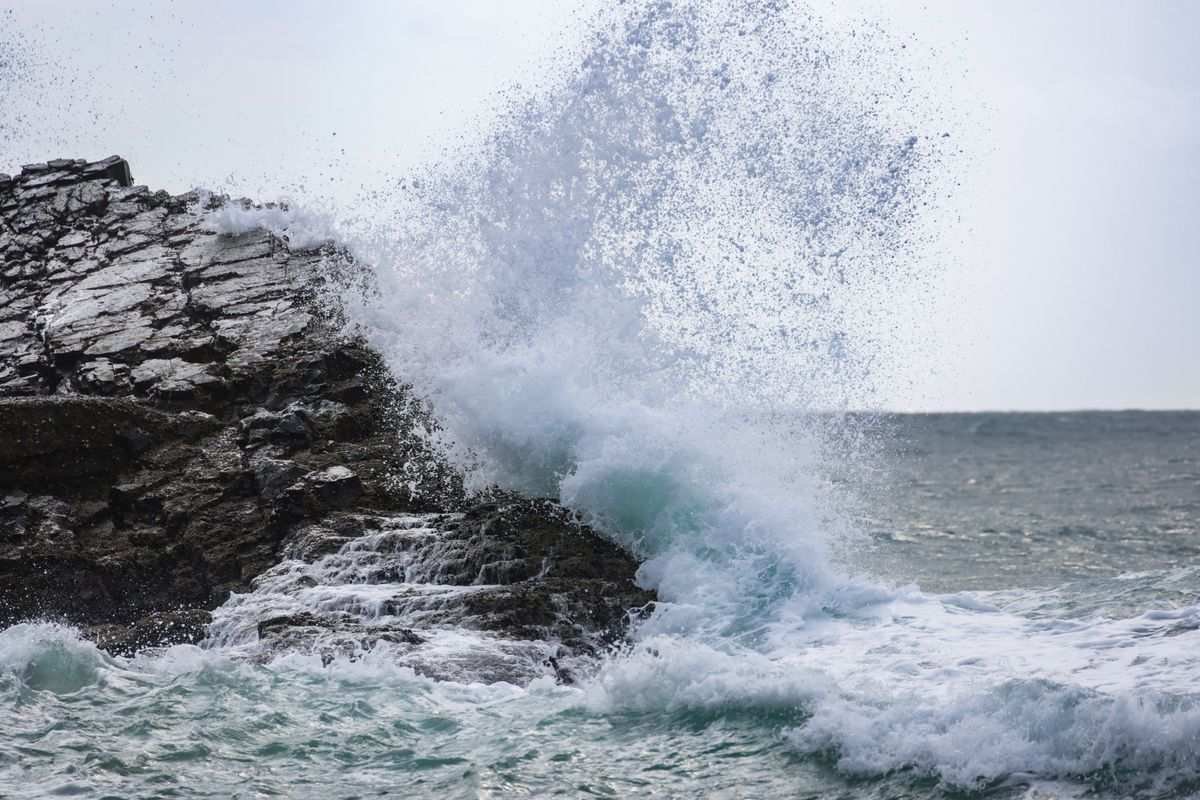 Waves crashing on rocks on a stormy coast