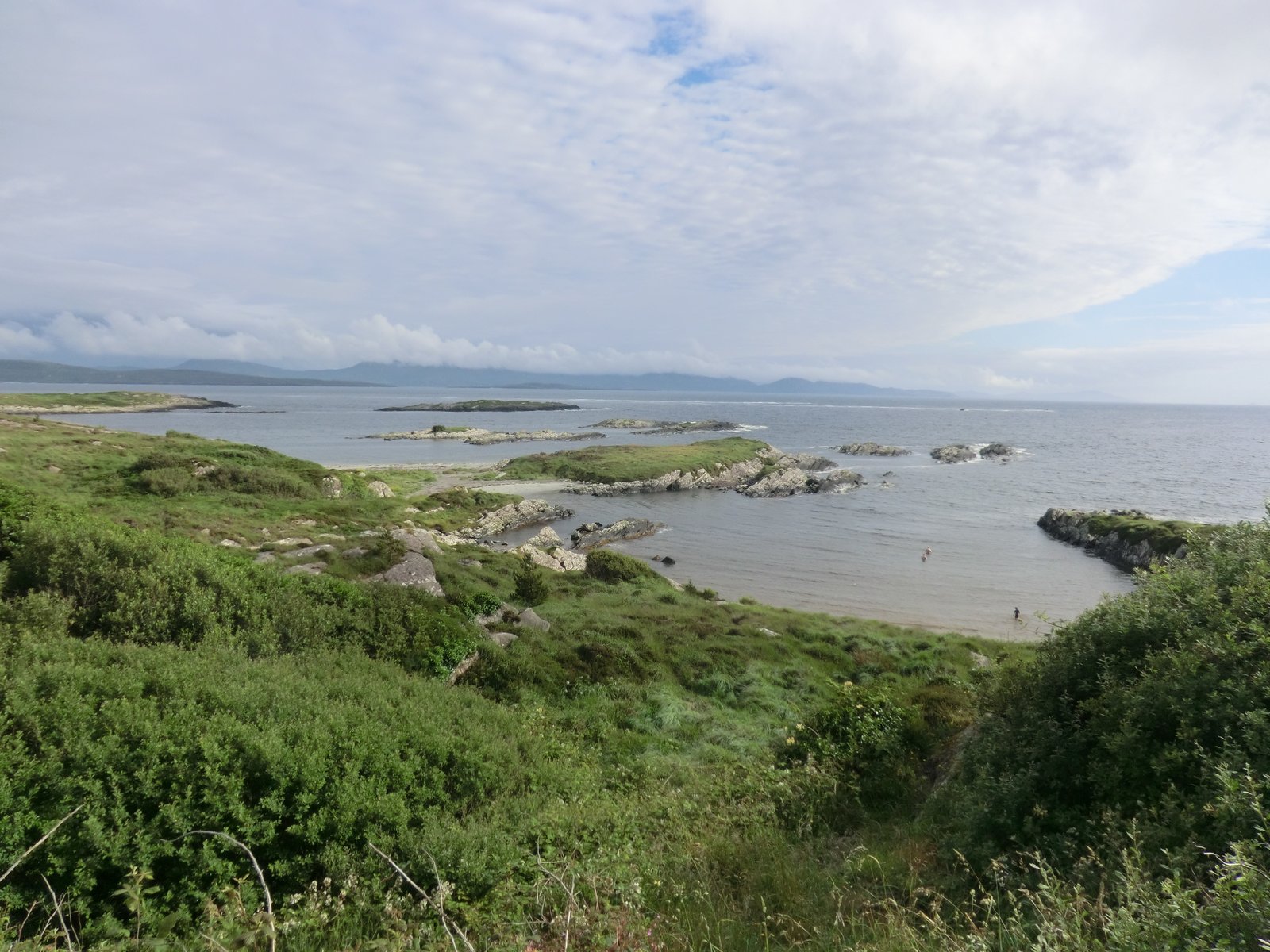 Quiet pale-sand beach in a protected bay in County Kerry