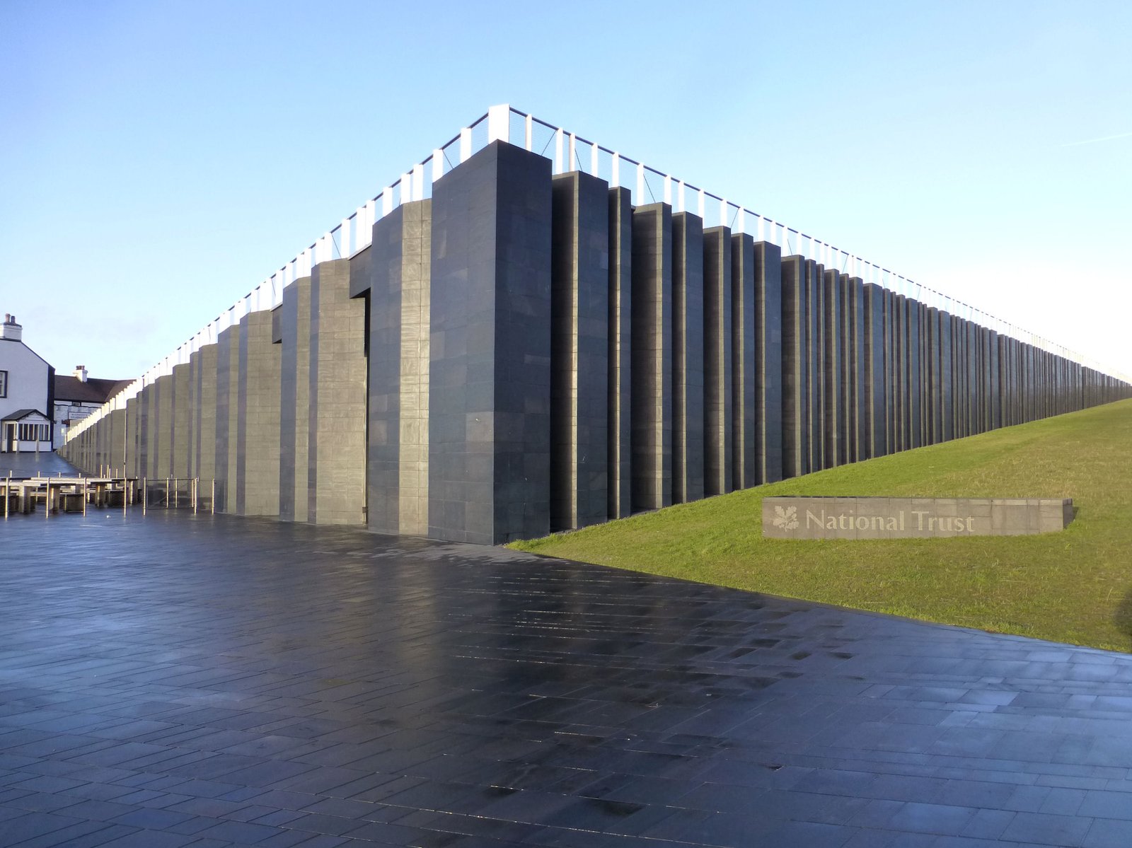 The Giant's Causeway Visitor Center building with the National Trust sign on a clear day