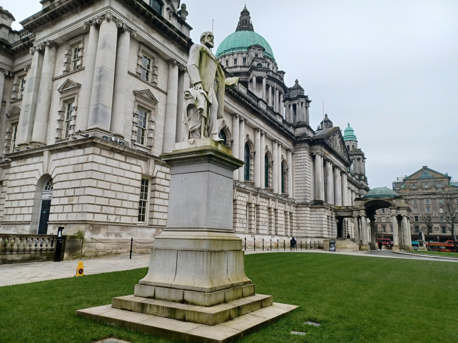 A monument and the lawn beside Belfast City Hall