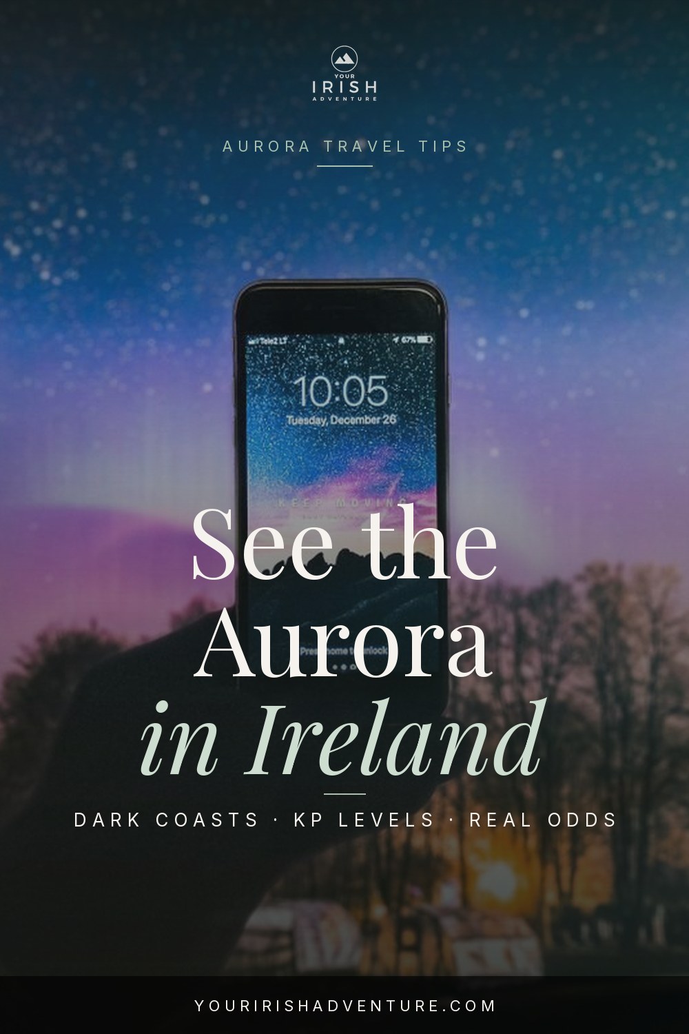 Faint pink and green northern lights above the Antrim coast in Ireland on a clear winter night