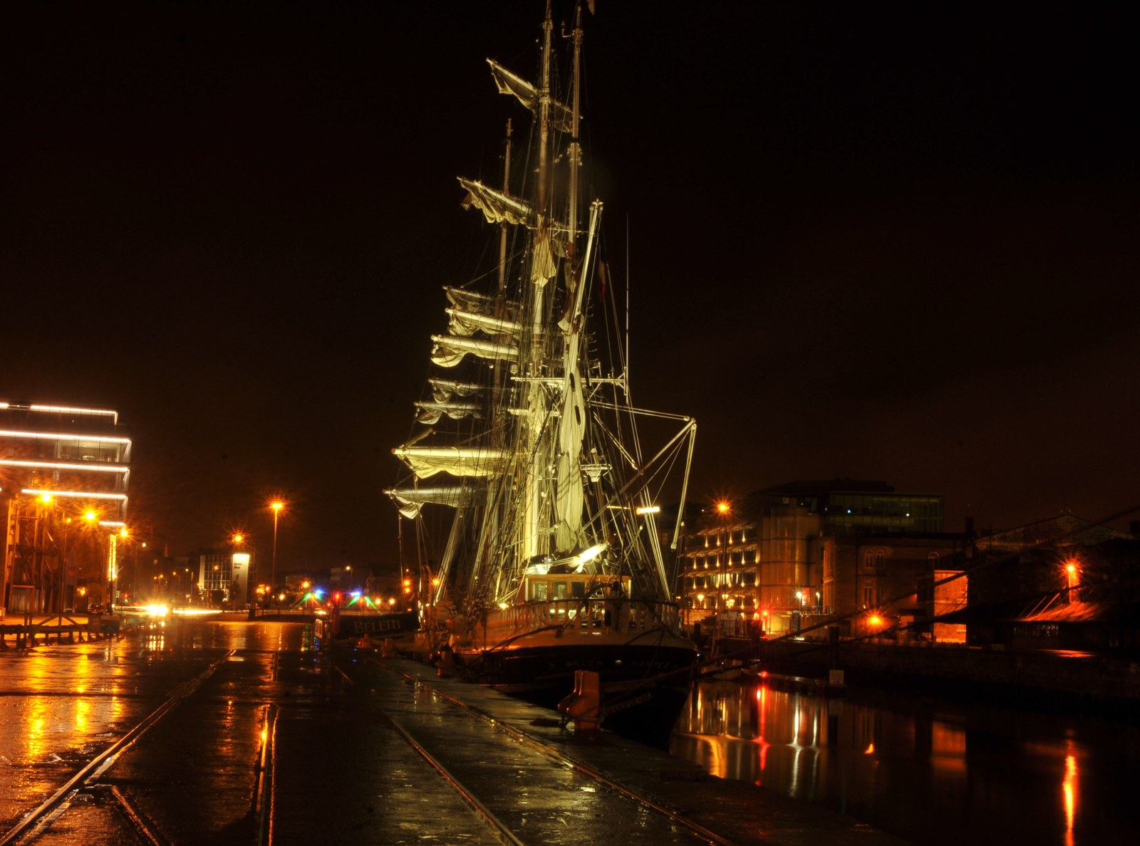 The tall ship Belem illuminated on the River Lee in Cork