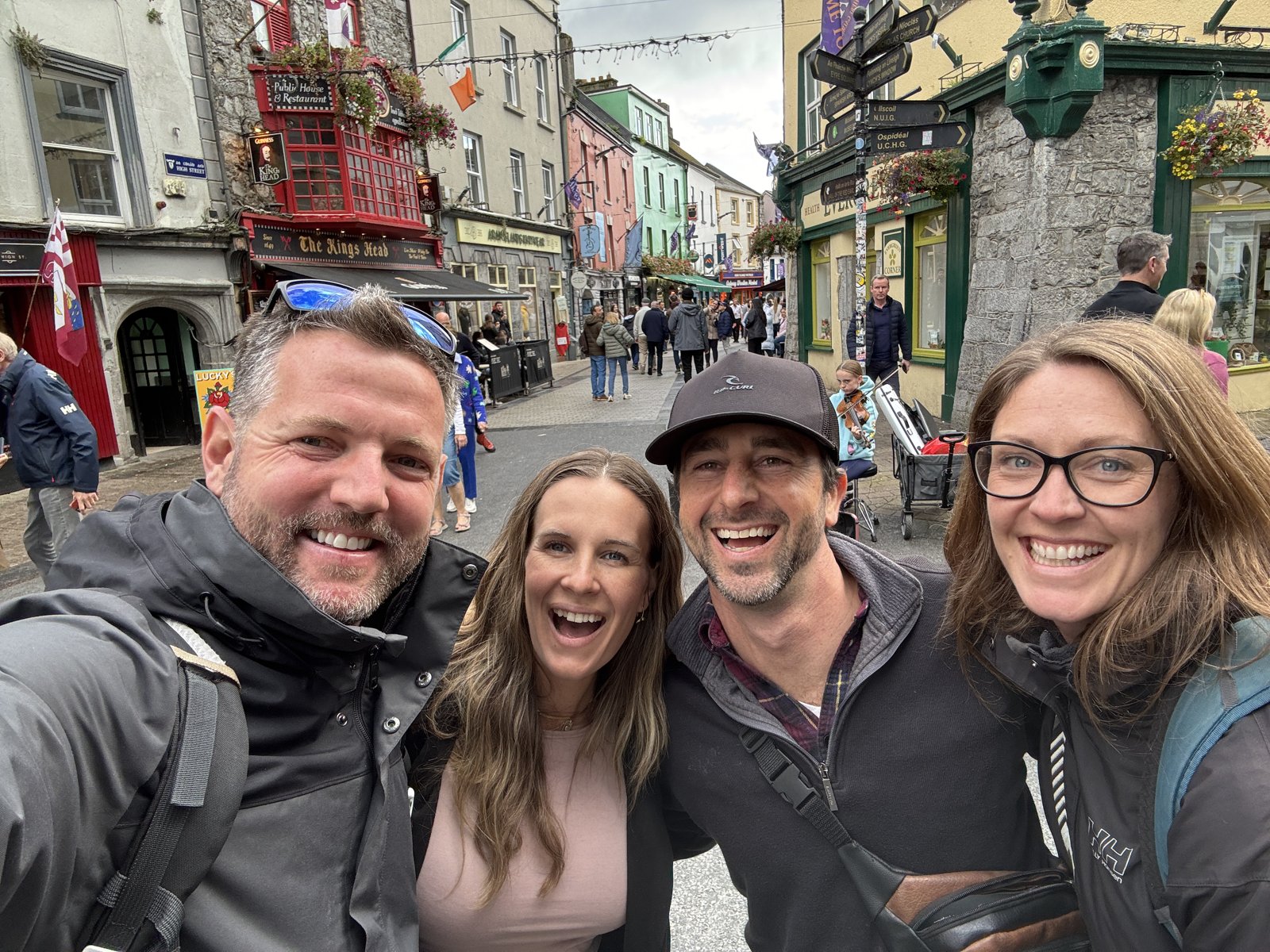Nick, Dariece, and friends wearing jackets on a Galway street