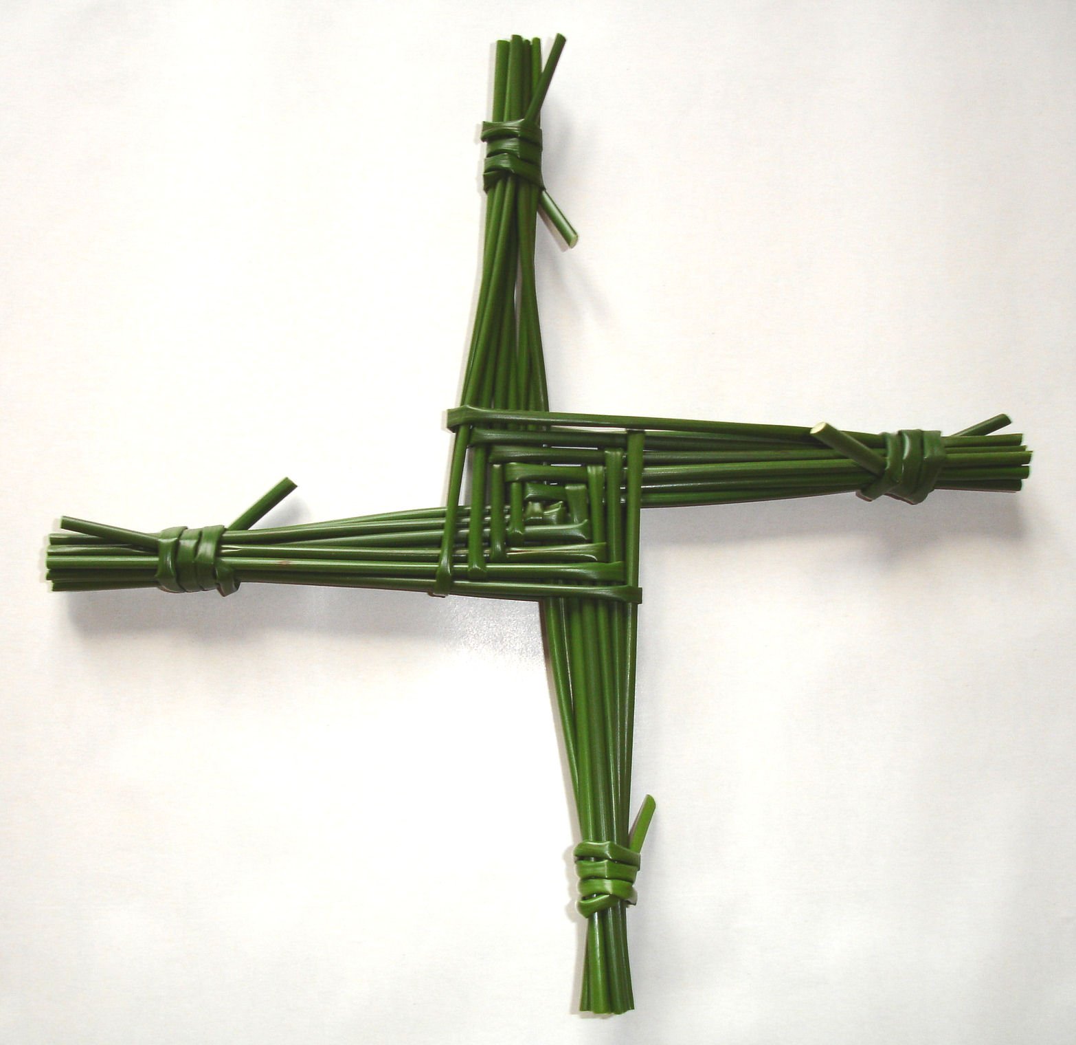 A handwoven St. Brigid's cross made from green rushes
