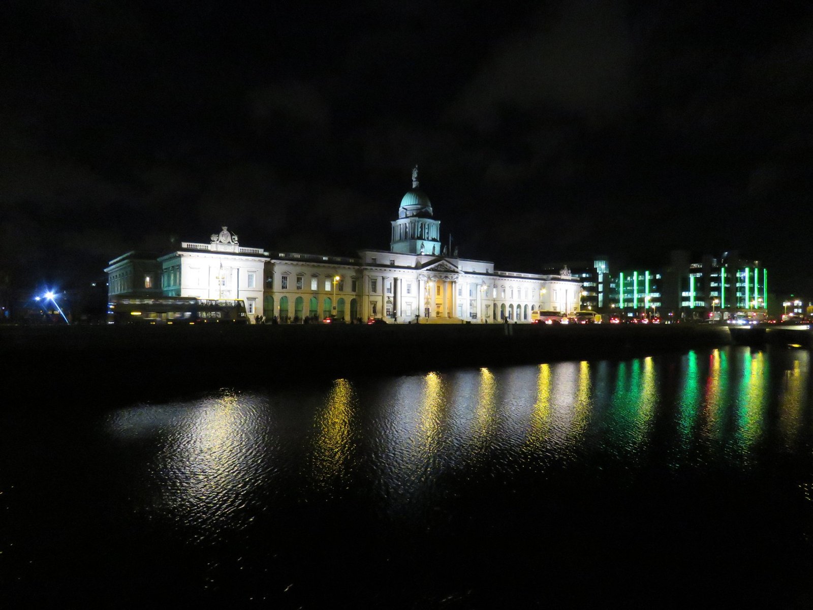 Illuminated Custom House reflected in the River Liffey