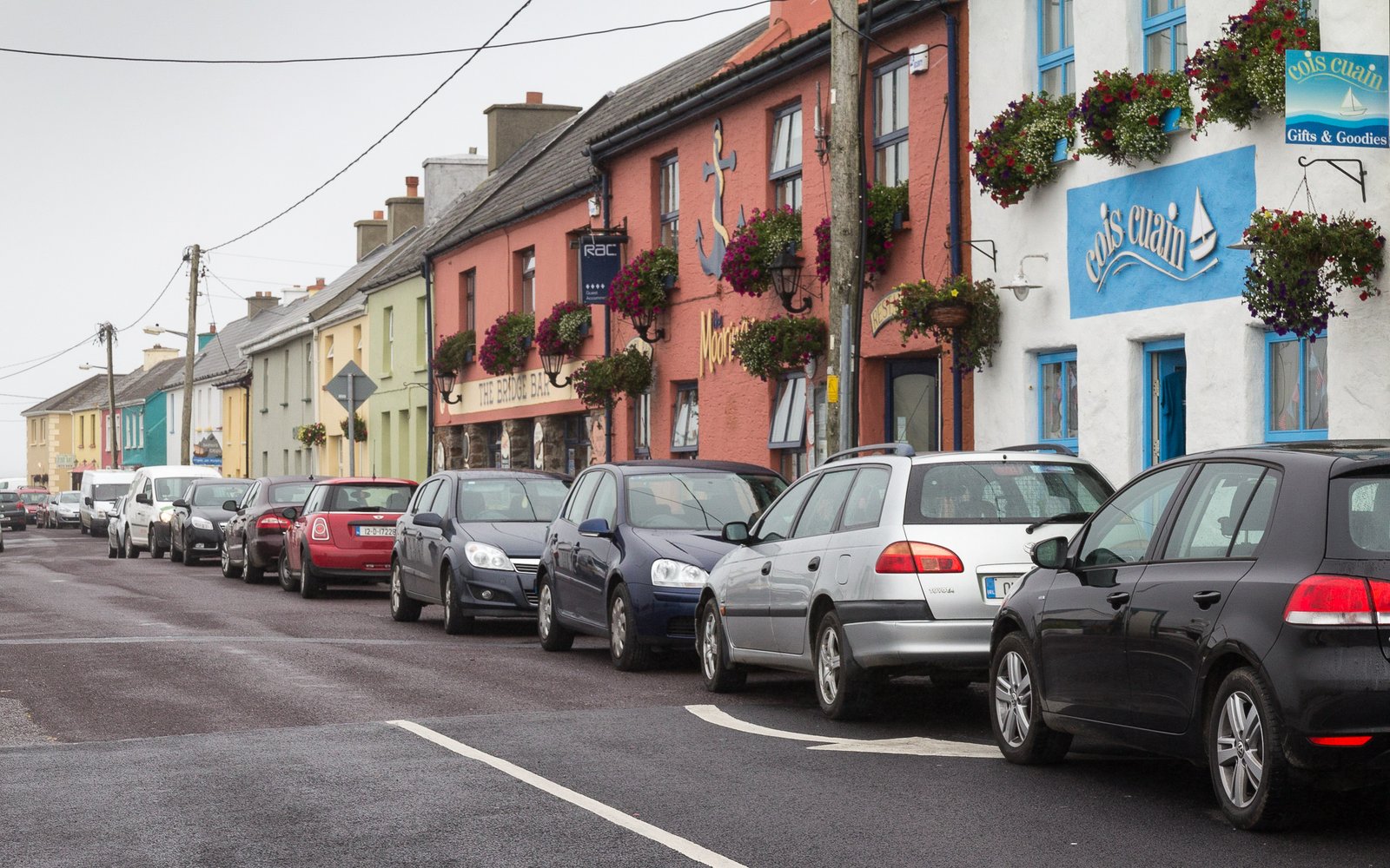 Colorful shopfronts and pub on the main street in Portmagee