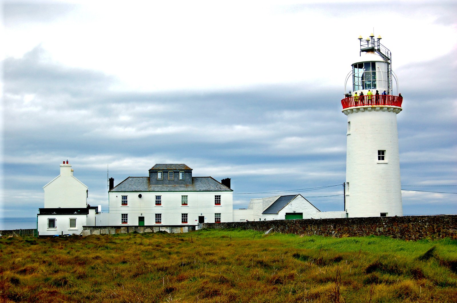 Loop Head Lighthouse and its white buildings in County Clare